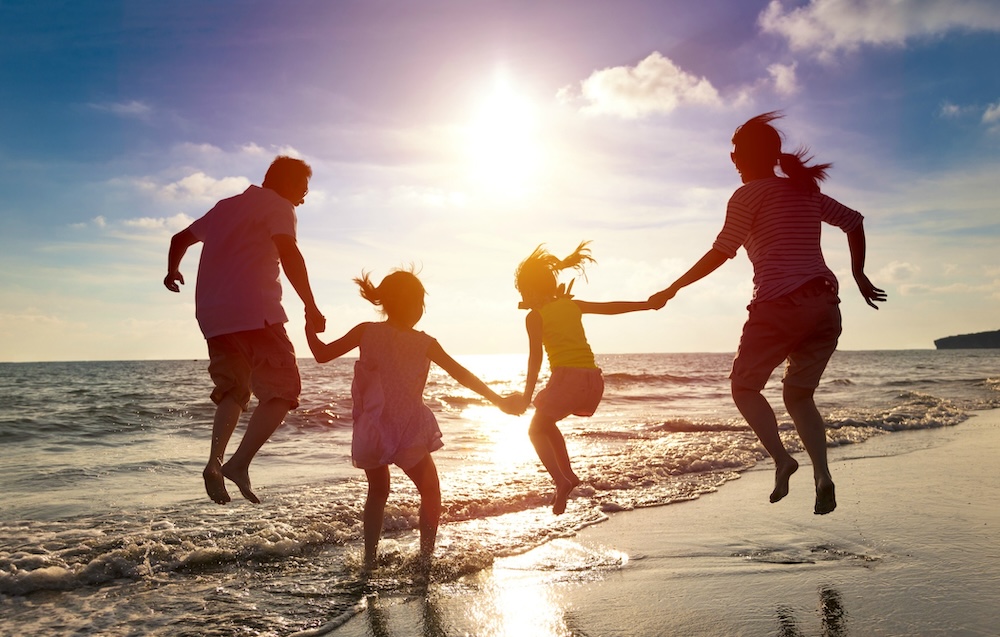 Family enjoying beach in the summer